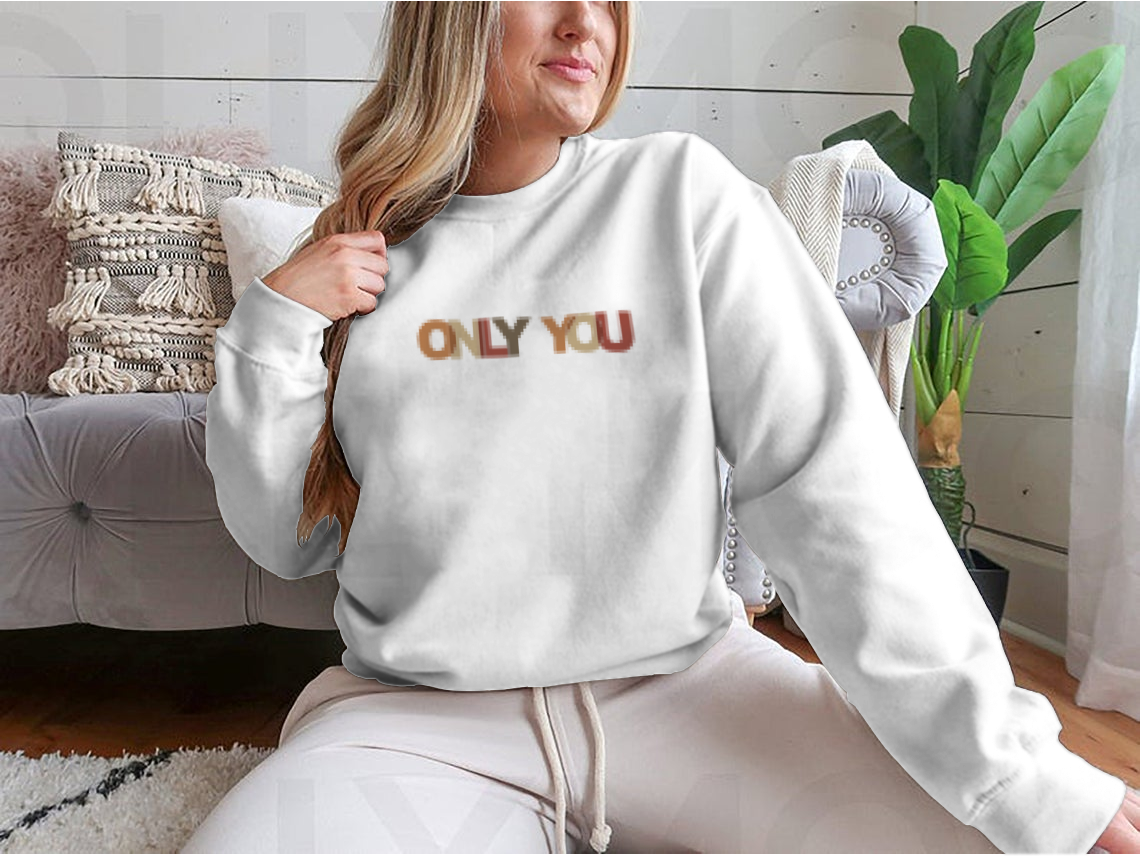 A cozy sweatshirt featuring a motivational quote design, made from soft cotton, perfect for casual wear.