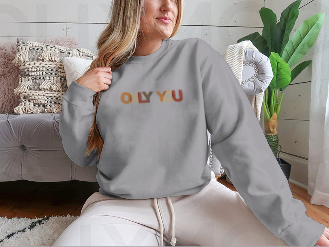 A cozy sweatshirt featuring a motivational quote design, made from soft cotton, perfect for casual wear.