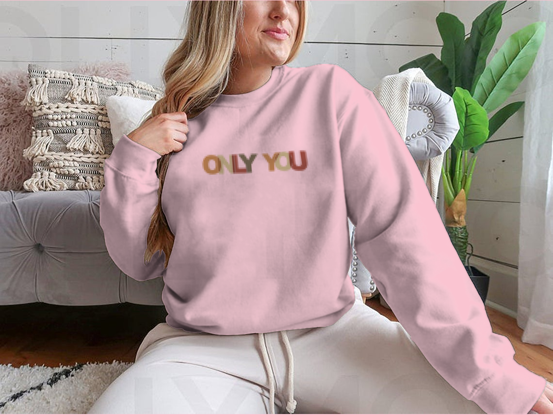 A cozy sweatshirt featuring a motivational quote design, made from soft cotton, perfect for casual wear.