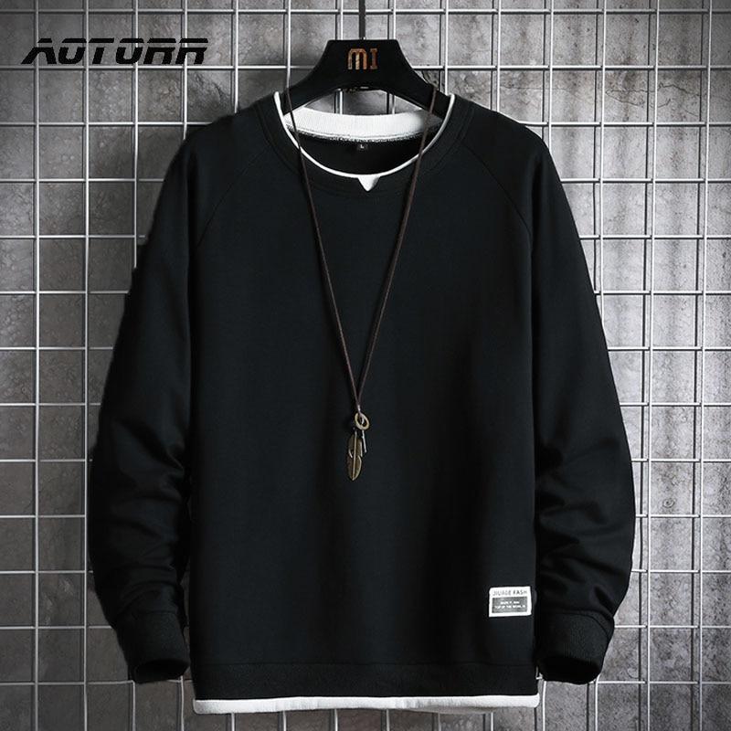 Oversized black sweatshirt by Aotorr featuring full sleeves and O-neck collar, perfect for casual wear.