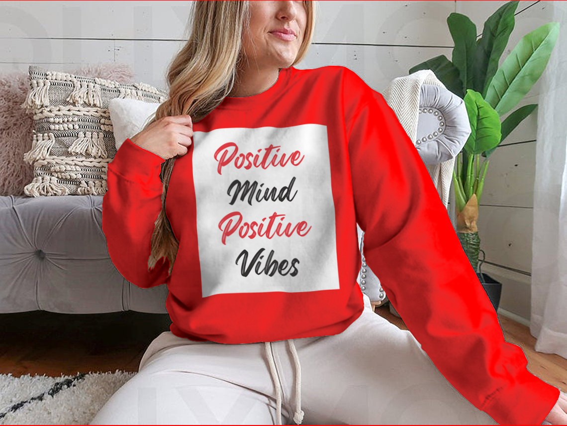 A cozy sweatshirt featuring a stylish calligraphy design that reads 'Positive Mind Positive Vibes', perfect for casual wear.