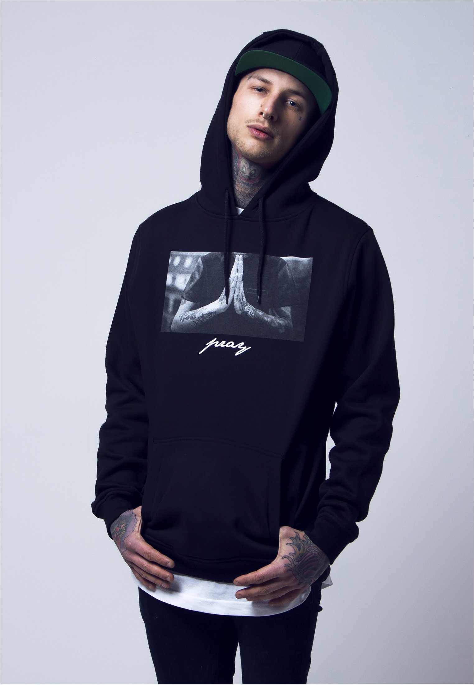 A stylish Pray Hoodie featuring a bold print, made from soft brushed fleece fabric in a comfortable fit.