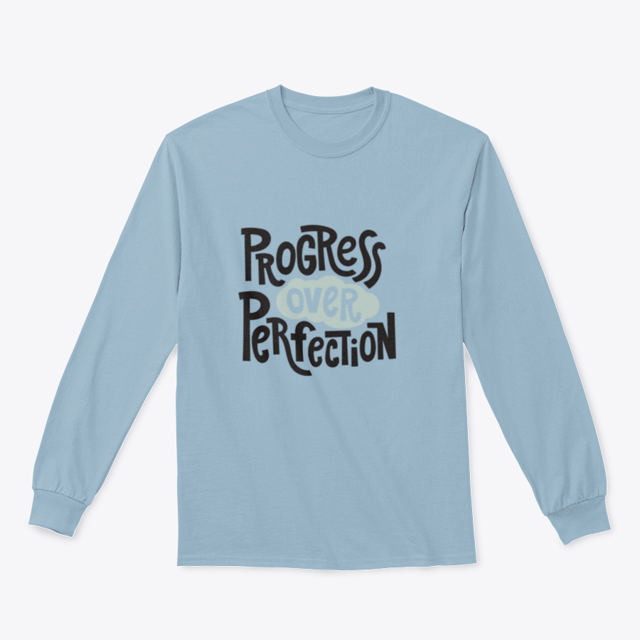 A stylish t-shirt featuring the inspirational quote 'Progress Over Perfection' in a unique design, made from soft cotton fabric.