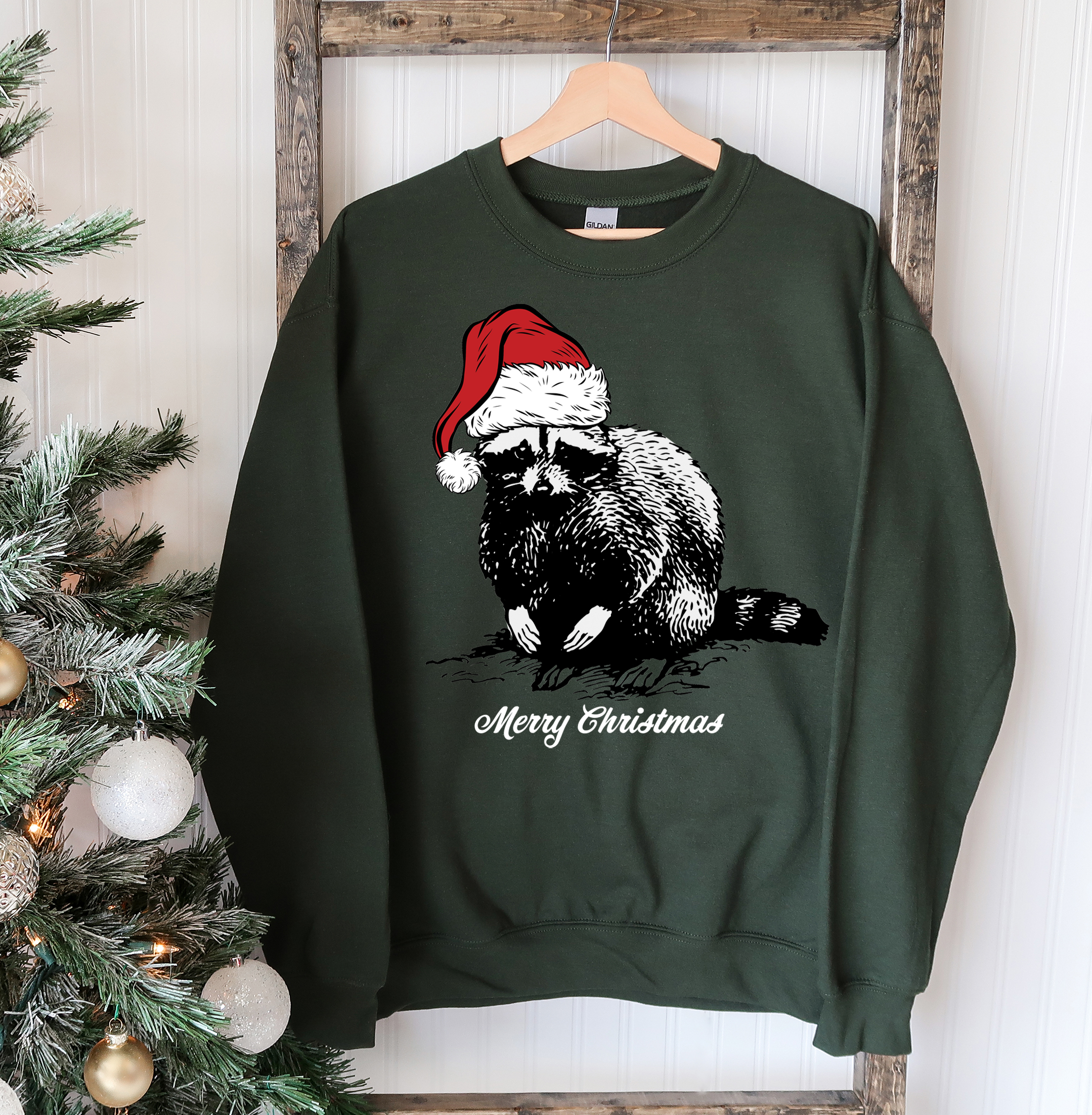 A cozy Racoon Christmas Sweatshirt featuring a festive racoon design, perfect for holiday celebrations and casual wear.