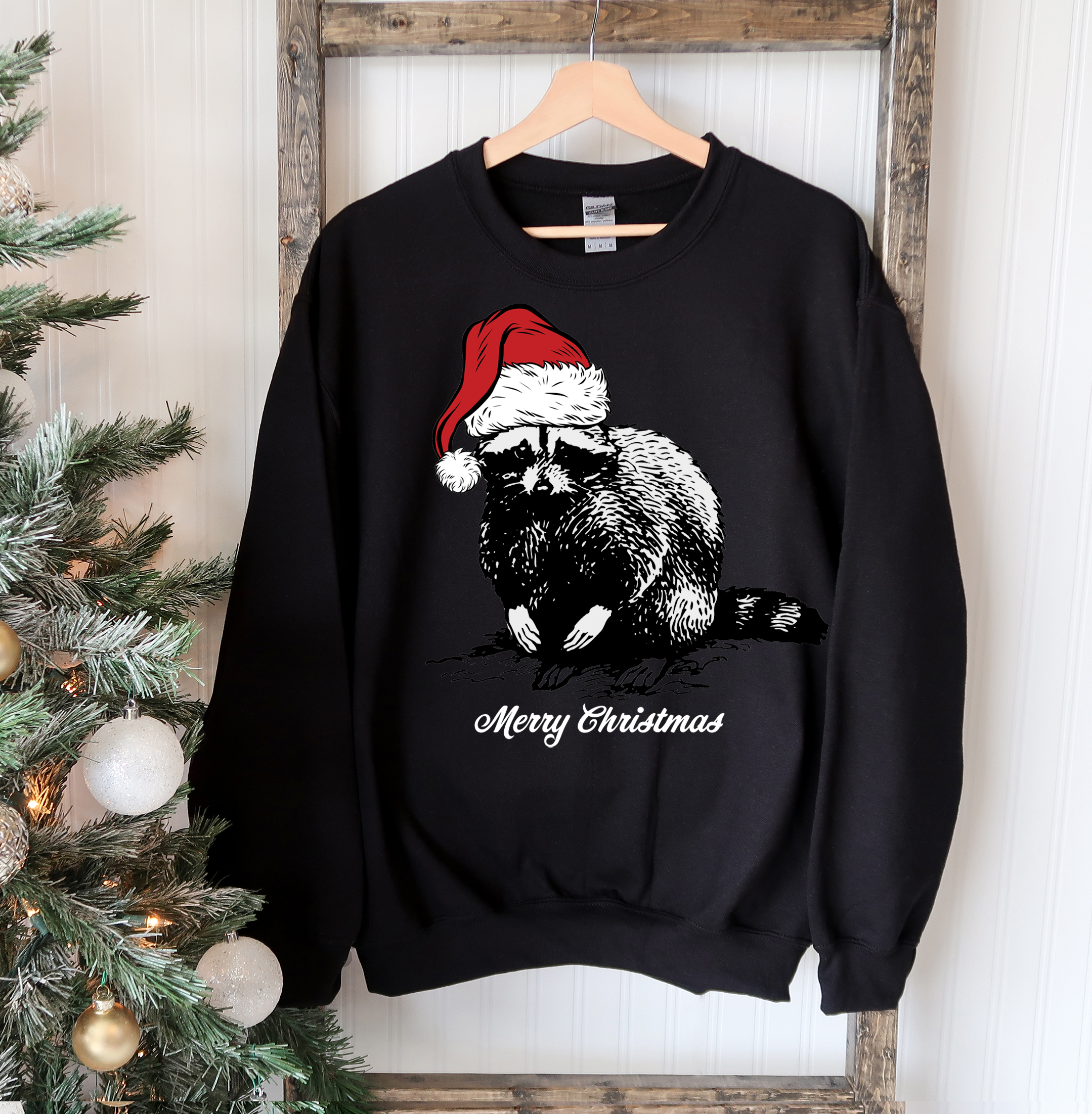 A cozy Racoon Christmas Sweatshirt featuring a festive racoon design, perfect for holiday celebrations and casual wear.