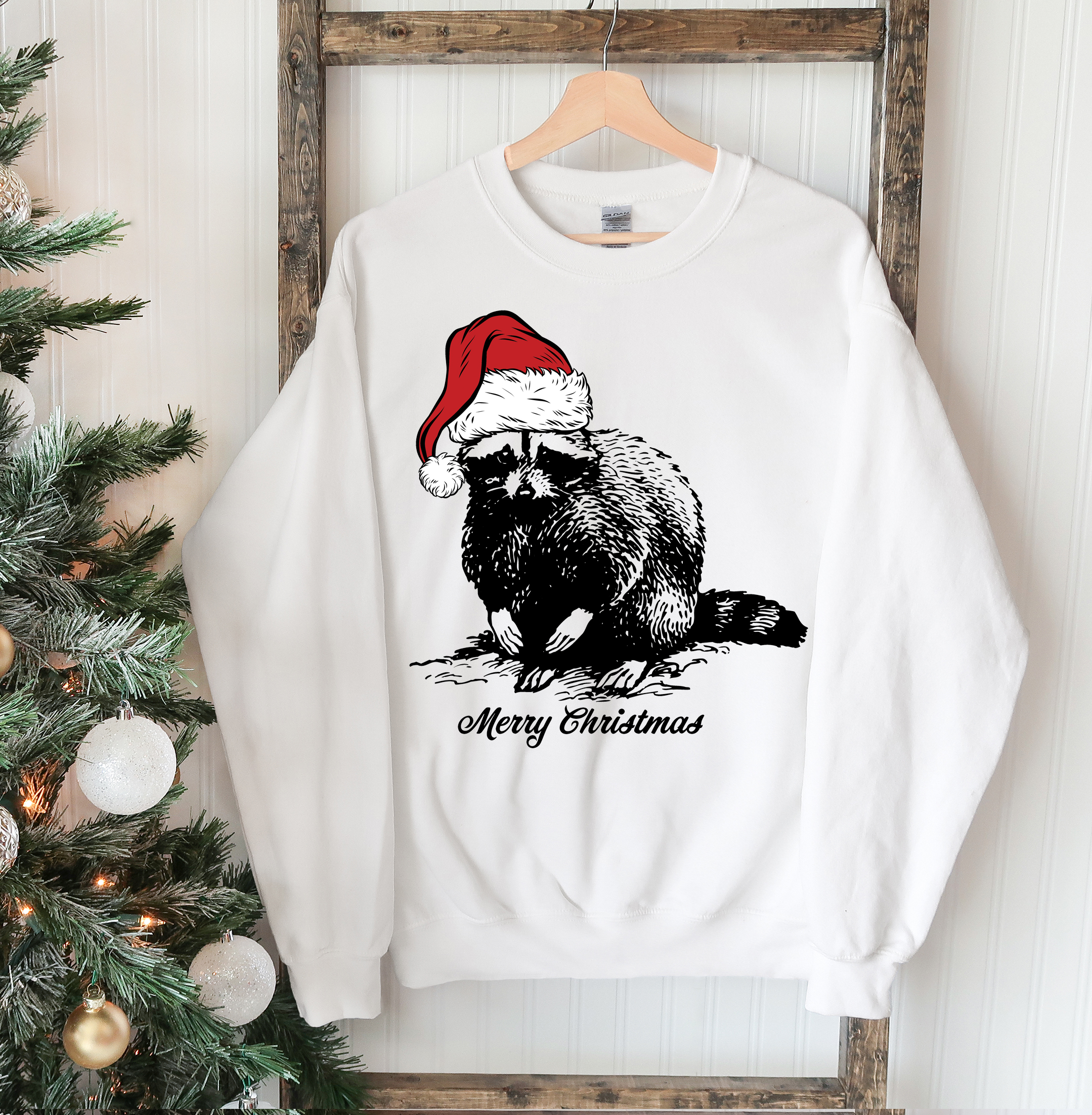 A cozy Racoon Christmas Sweatshirt featuring a festive racoon design, perfect for holiday celebrations and casual wear.