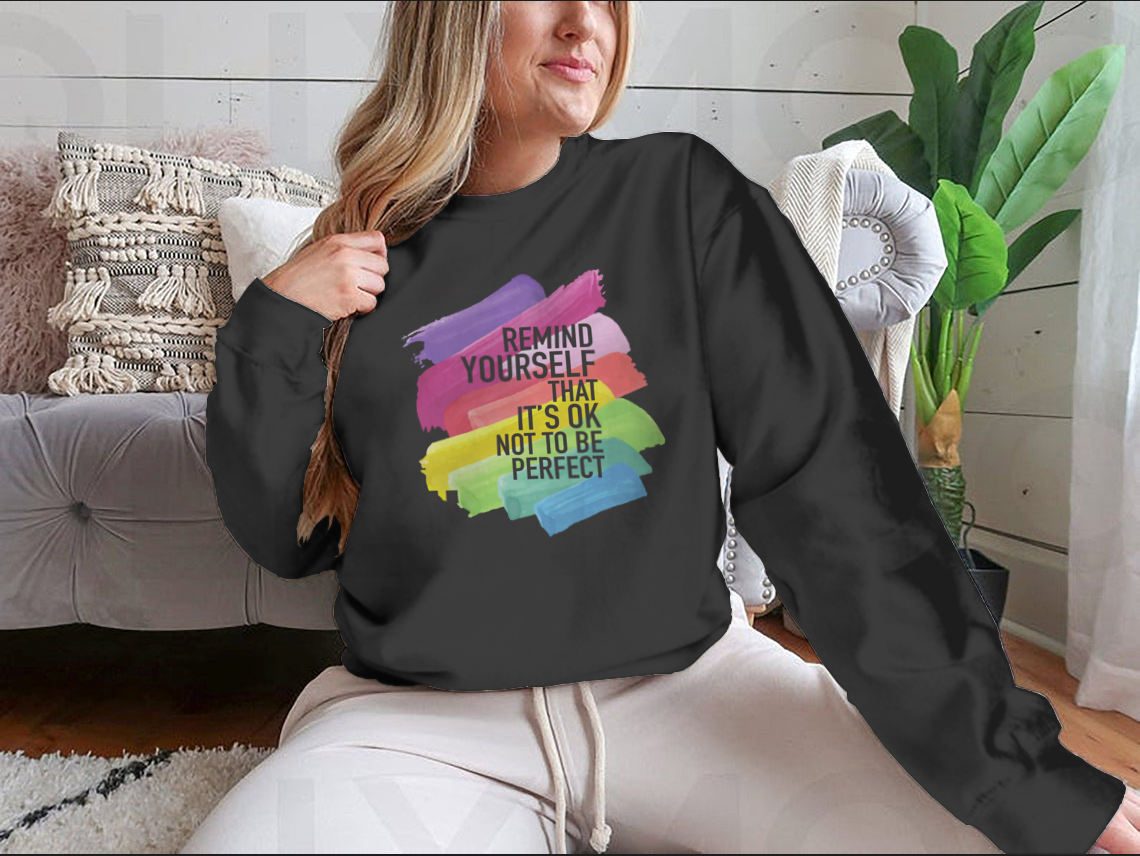 A soft cotton/polyester blend t-shirt featuring the inspirational message 'Remind Yourself That It Is Ok Not To Be Perfect' in a stylish design.