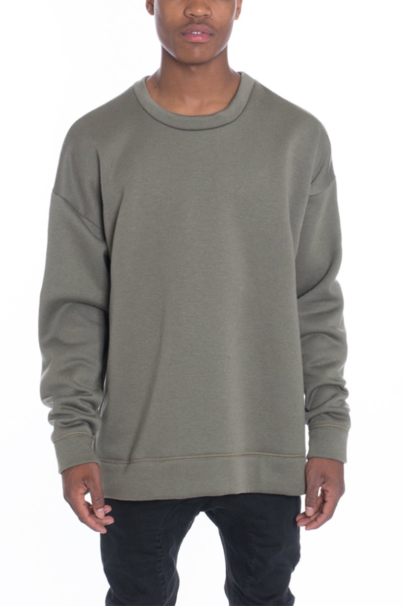 SIDEPANEL PULLOVER featuring a round neck, high-low design, and slit hem, made from 80% cotton and 20% polyester.