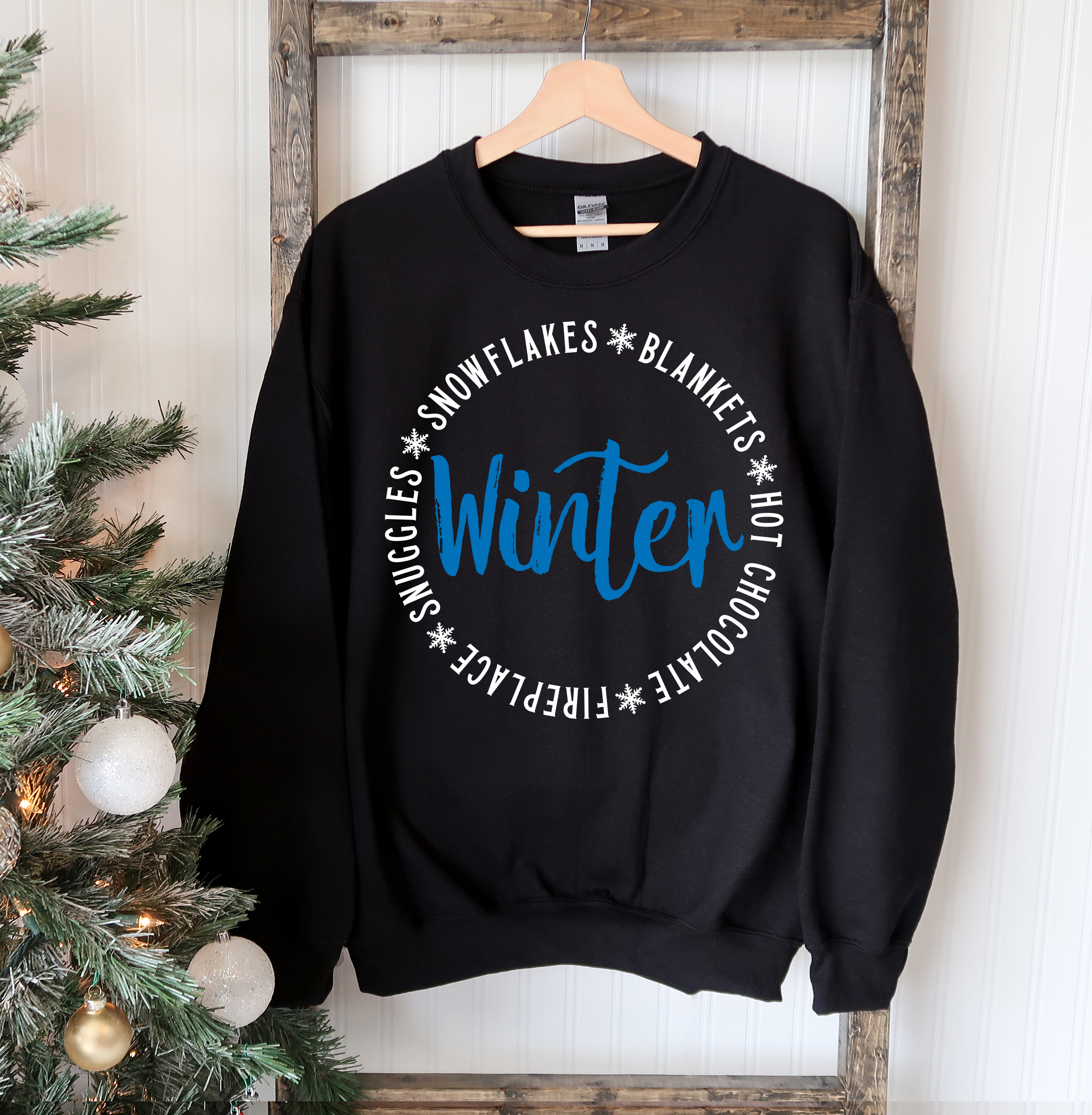 Cozy unisex Snowflakes Blankets Winter Sweatshirt in soft fabric, featuring a crew neck and rib-knit collar, perfect for winter wear.