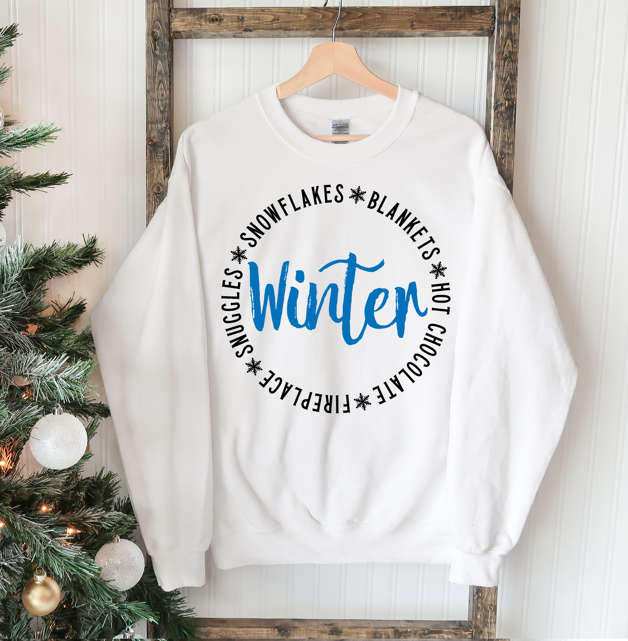 Cozy unisex Snowflakes Blankets Winter Sweatshirt in soft fabric, featuring a crew neck and rib-knit collar, perfect for winter wear.