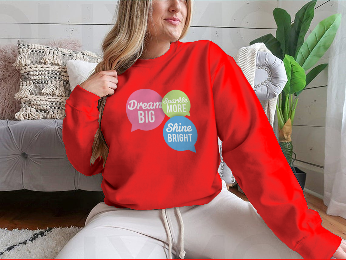 A stylish t-shirt featuring a motivational Dream Big quote in colorful speech bubbles, made from a soft cotton/polyester blend.