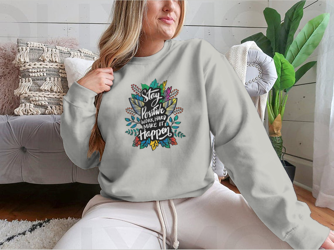 A stylish hand-lettered design featuring the phrase 'Stay Positive And Work Hard Make It Happen' on a comfortable cotton-polyester blend shirt.