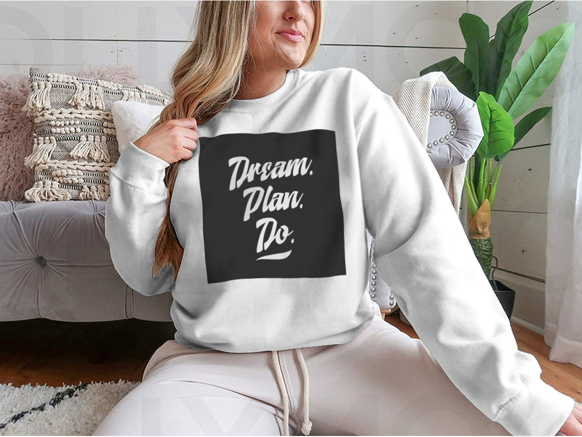 A cozy sweatshirt featuring an inspirational quote, showcasing high-quality cotton fabric and a classic fit.