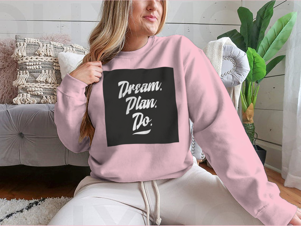 A cozy sweatshirt featuring an inspirational quote, showcasing high-quality cotton fabric and a classic fit.