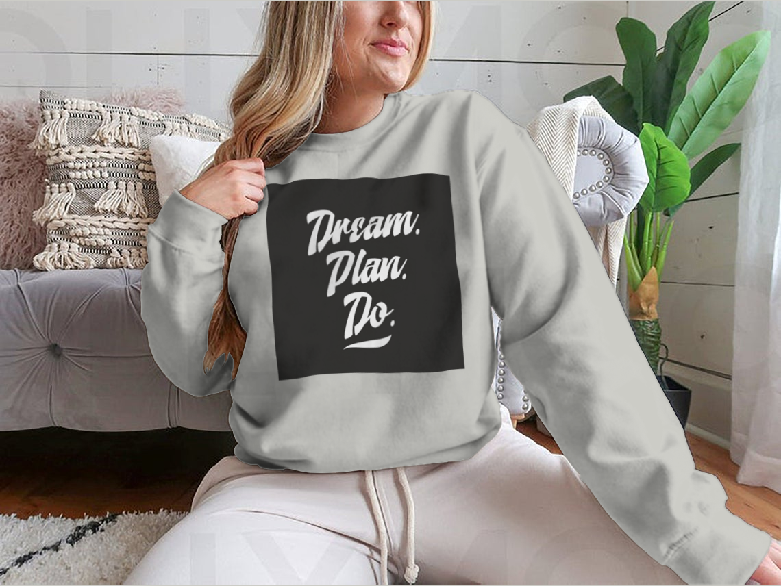 A cozy sweatshirt featuring an inspirational quote, showcasing high-quality cotton fabric and a classic fit.