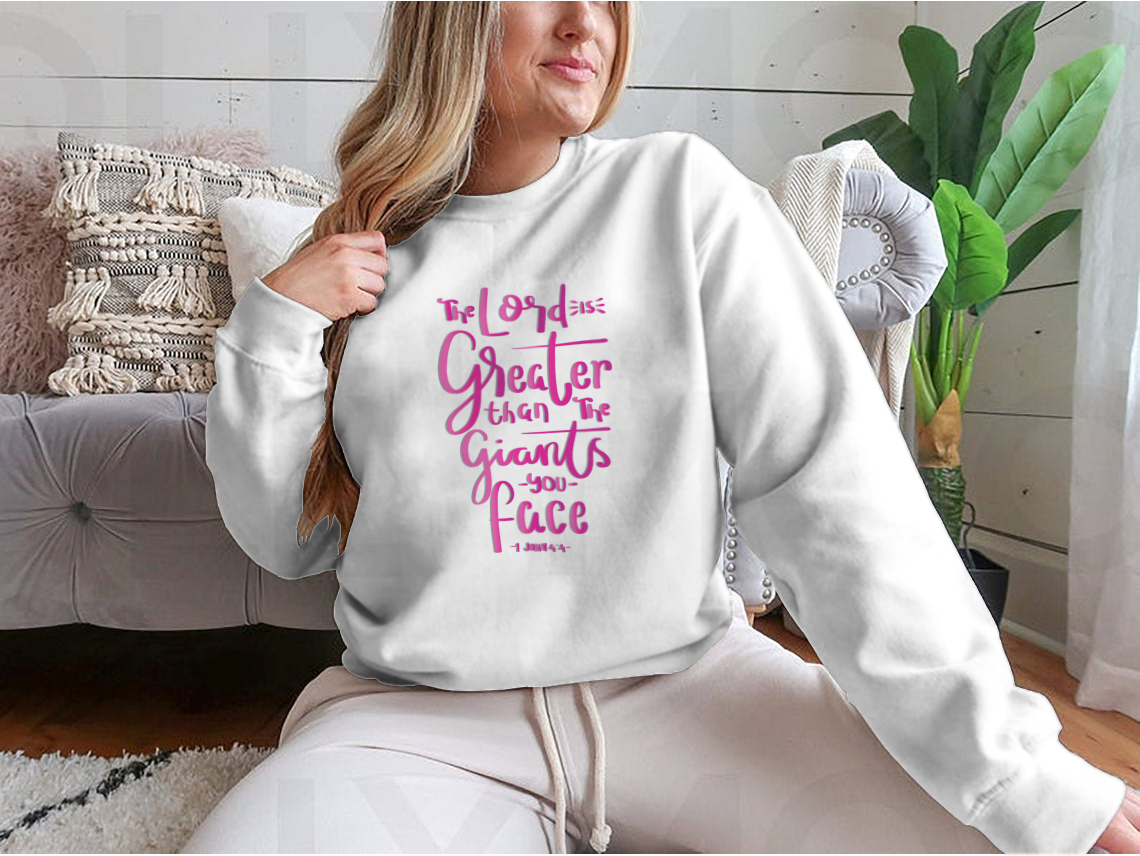 Woman wearing sweatshirt with motivational quote.