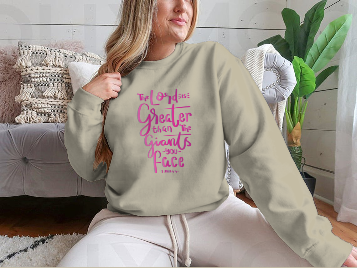 Woman wearing sweatshirt with inspirational text.