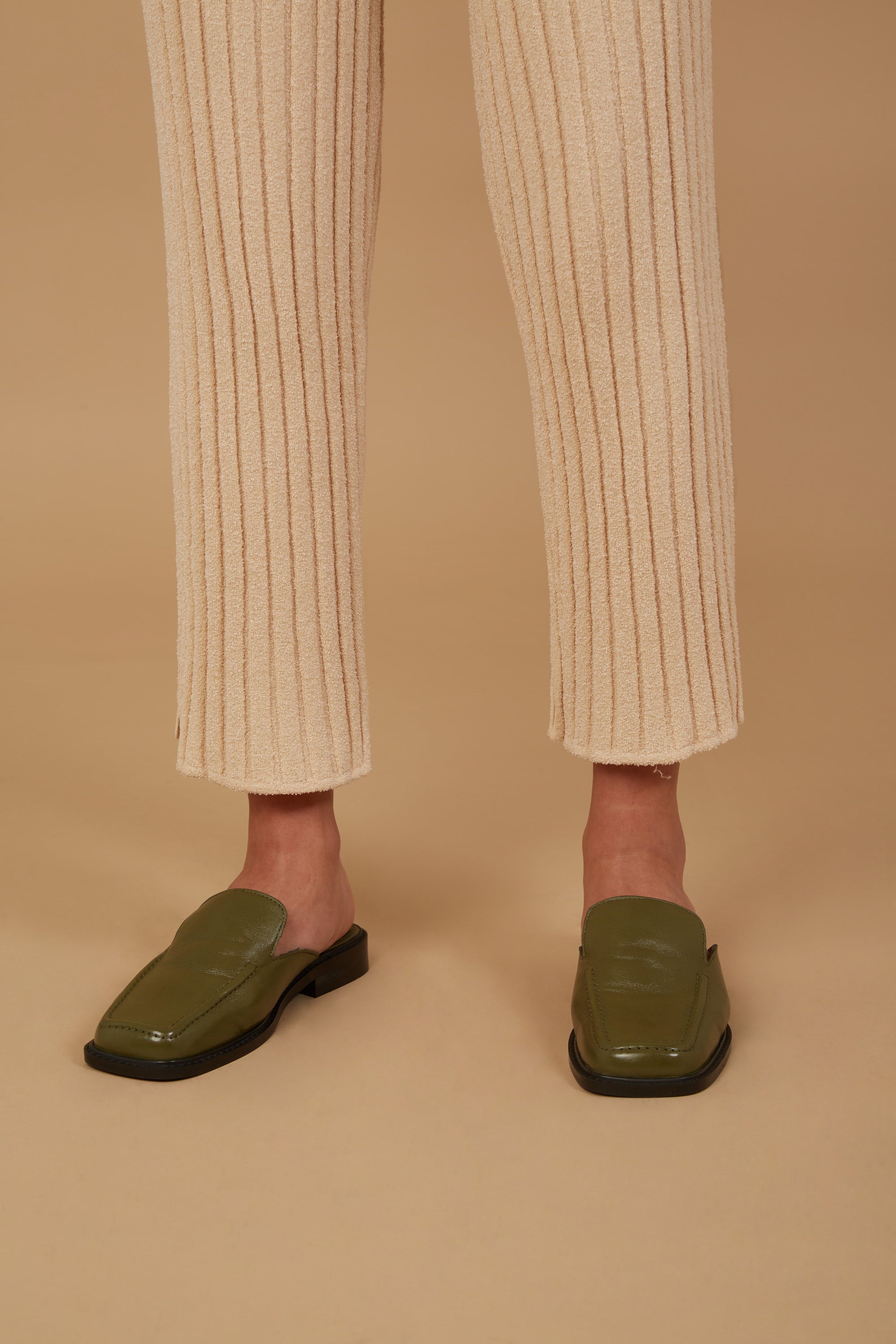 The Marie Pant in Champagne, featuring a soft corduroy texture, adjustable drawstring waist, and elastic ankle cuffs, perfect for smart casual wear.