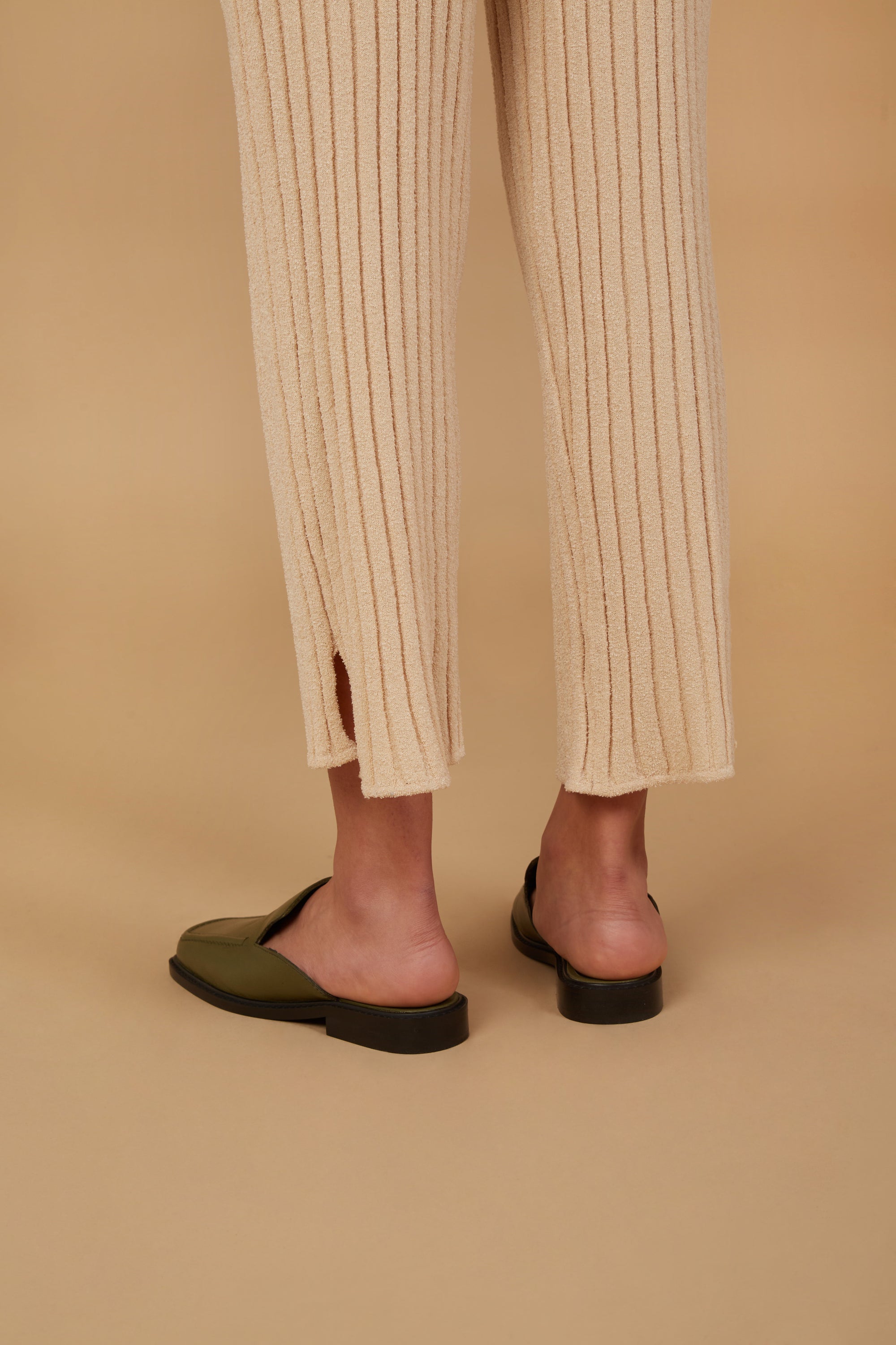 The Marie Pant in Champagne, featuring a soft corduroy texture, adjustable drawstring waist, and elastic ankle cuffs, perfect for smart casual wear.