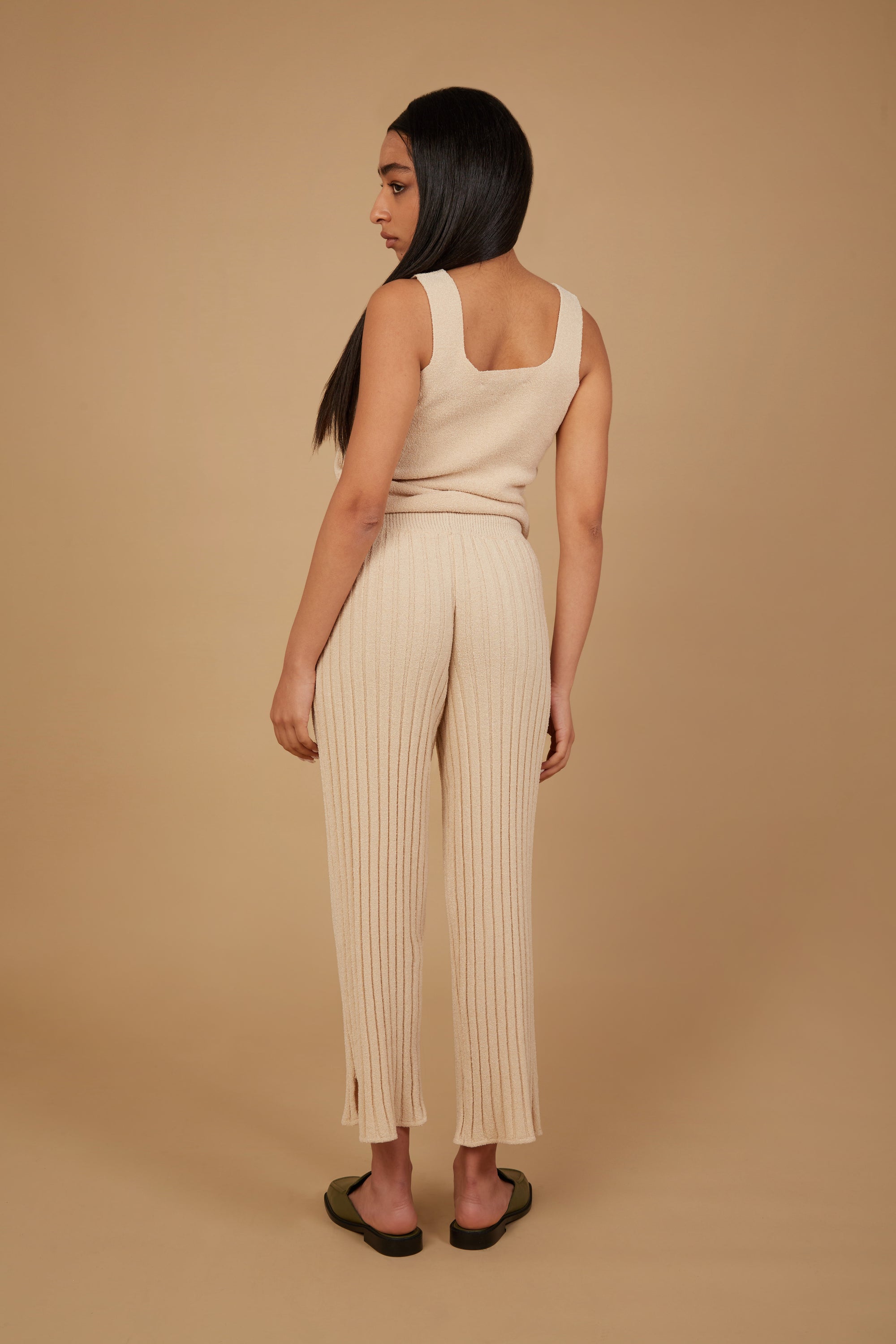 The Marie Pant in Champagne, featuring a soft corduroy texture, adjustable drawstring waist, and elastic ankle cuffs, perfect for smart casual wear.