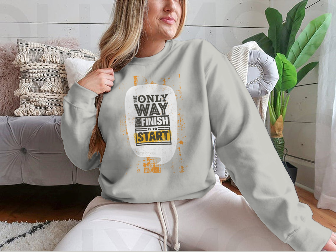 A stylish sweatshirt featuring the motivational phrase 'The Only Way To Finish Is To Start', made from a comfortable cotton/polyester blend.