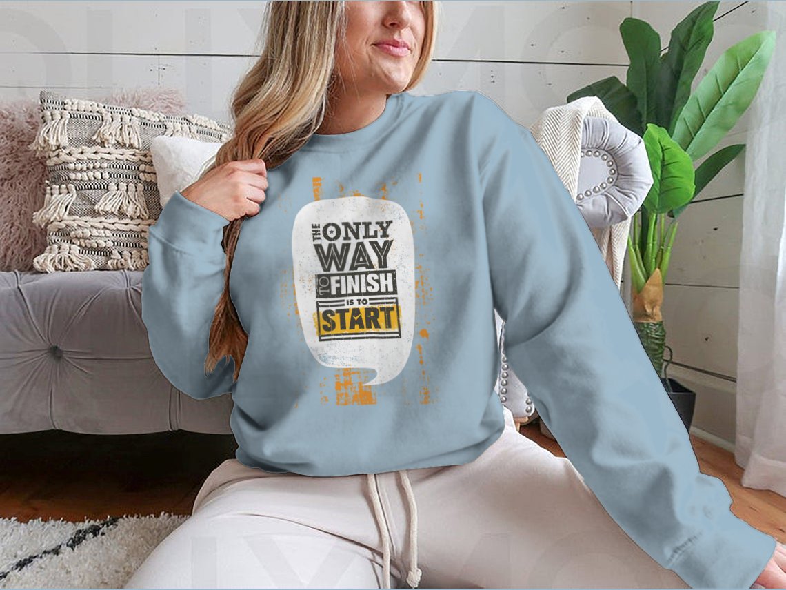 A stylish sweatshirt featuring the motivational phrase 'The Only Way To Finish Is To Start', made from a comfortable cotton/polyester blend.