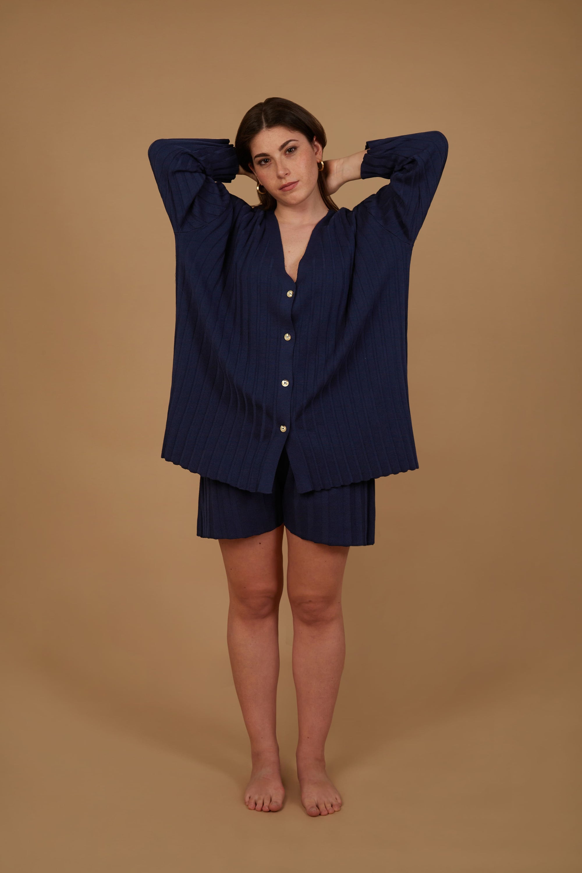 The Ophra Cardigan in Blu Royal, featuring an oversized fit, V-neck design, buttons, and pockets, perfect for stylish comfort.