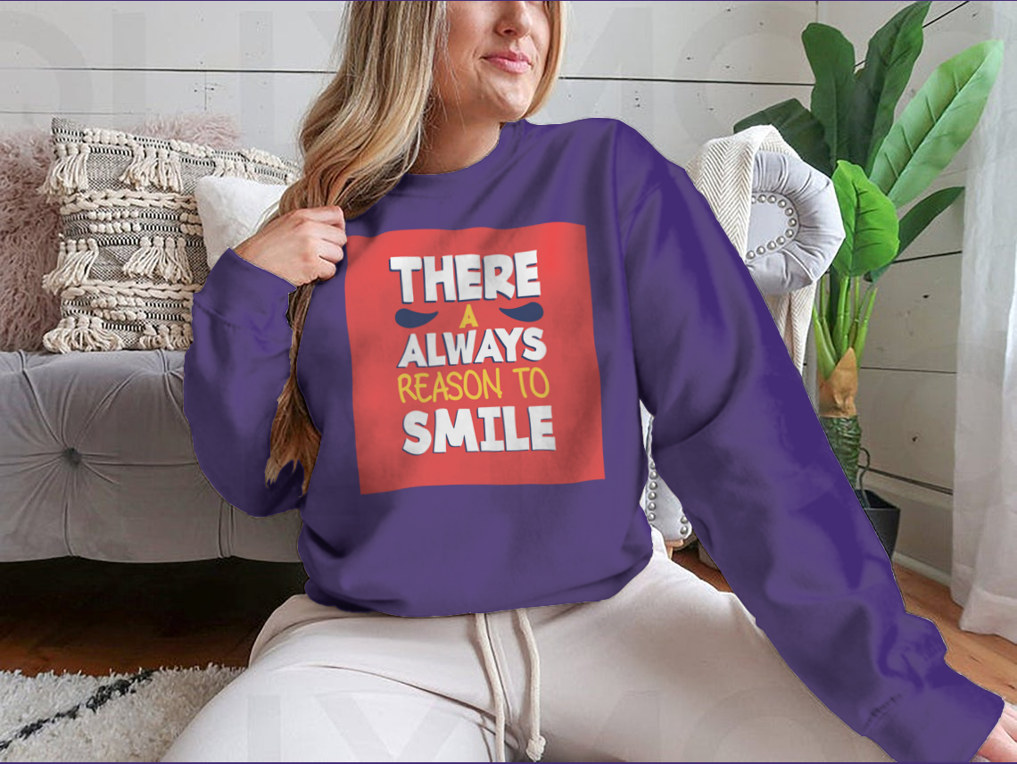 A stylish t-shirt featuring the phrase 'There’s Always a Reason to Smile', showcasing a classic fit and soft fabric.