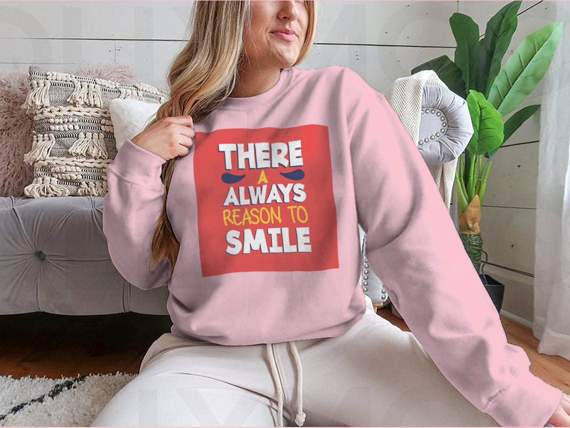 A stylish t-shirt featuring the phrase 'There’s Always a Reason to Smile', showcasing a classic fit and soft fabric.