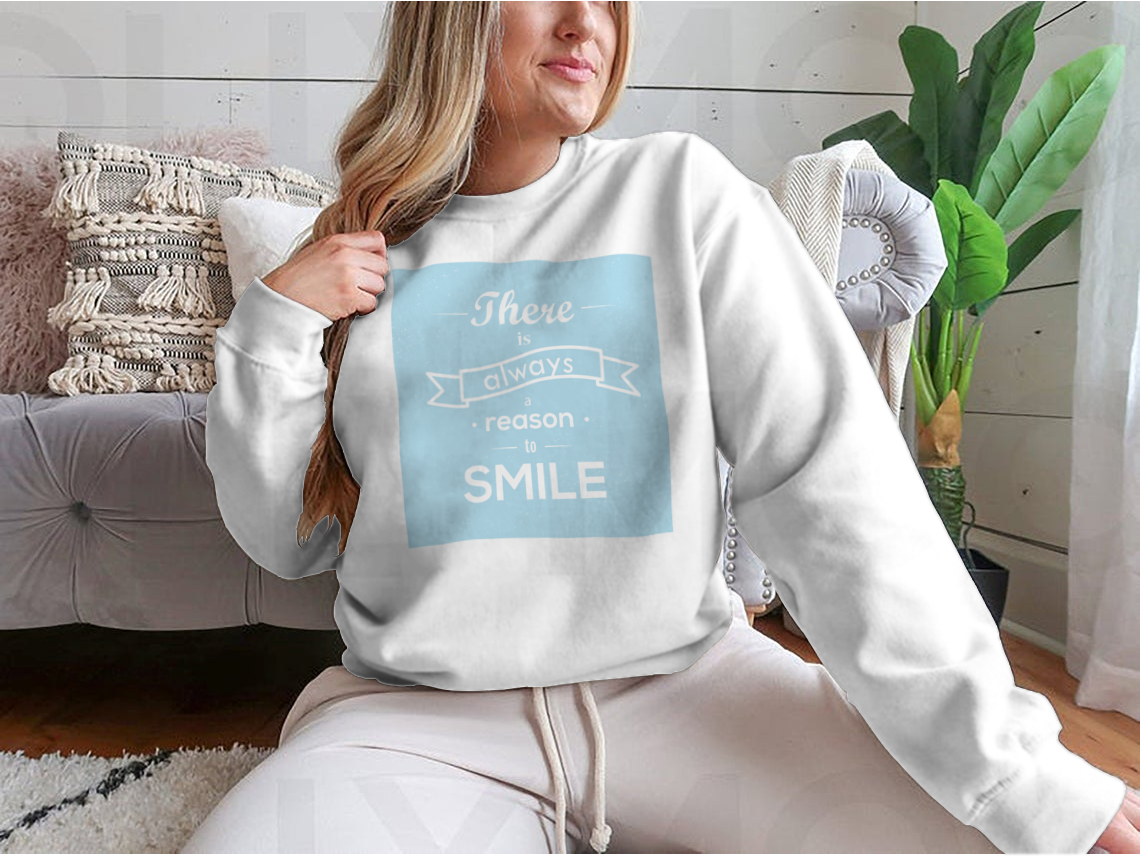 A motivational typography design featuring the phrase 'There Is Always Reason To Smile' on a comfortable cotton-polyester blend fabric.