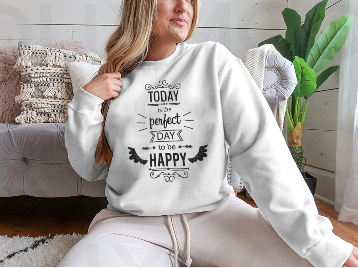 A stylish t-shirt featuring the inspirational quote 'Today Is The Perfect Day To Be Happy' in a vibrant design, made from a soft cotton/polyester blend.