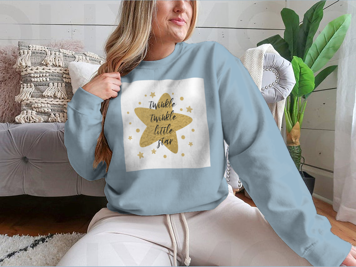 A charming garment featuring the text 'Twinkle Twinkle Little Star' surrounded by cute golden stars, showcasing a playful design.