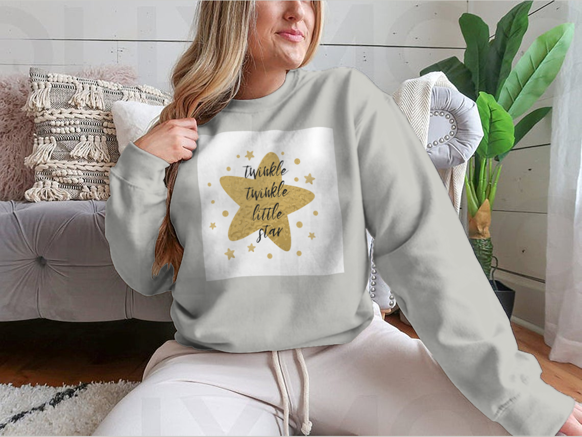 A charming garment featuring the text 'Twinkle Twinkle Little Star' surrounded by cute golden stars, showcasing a playful design.