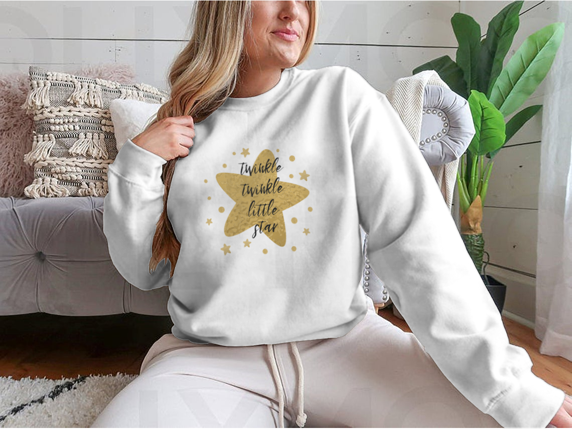 A charming garment featuring the text 'Twinkle Twinkle Little Star' surrounded by cute golden stars, showcasing a playful design.