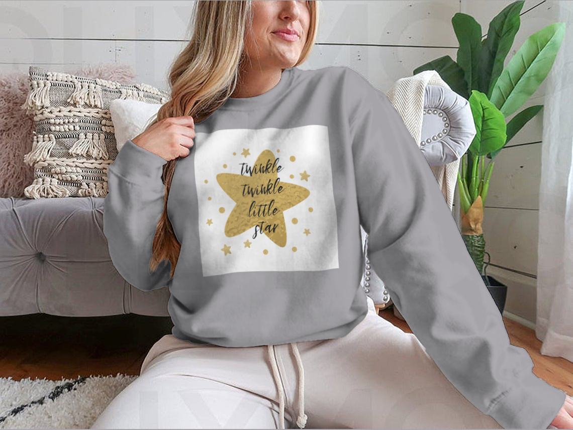 A charming garment featuring the text 'Twinkle Twinkle Little Star' surrounded by cute golden stars, showcasing a playful design.