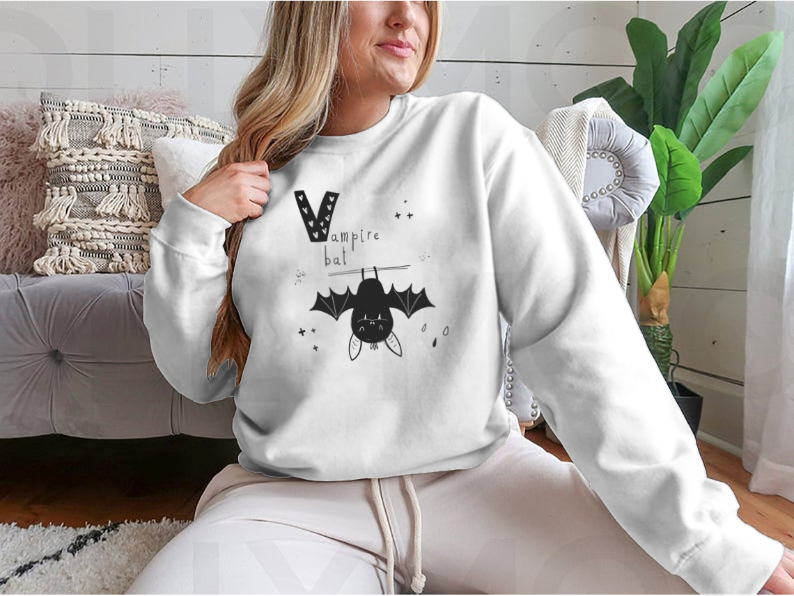 Vector hand-drawn illustration of a baby with a vampire bat and letter V, showcasing playful and whimsical design elements.