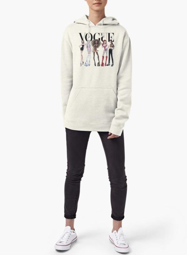 Person wearing Vogue hoodie standing.