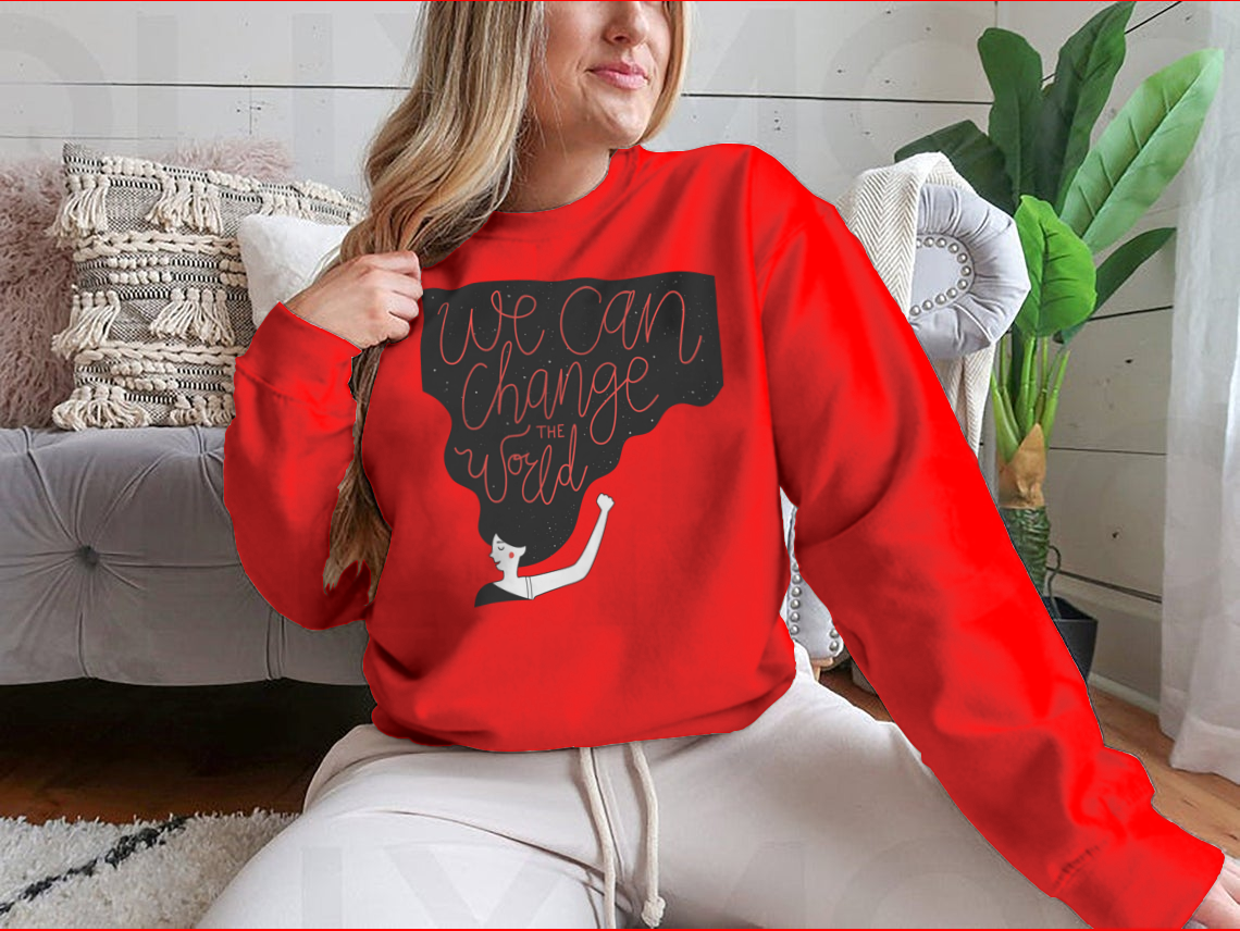 A cozy sweatshirt featuring the motivational quote 'We Can Change The World' in stylish typography, perfect for casual wear.