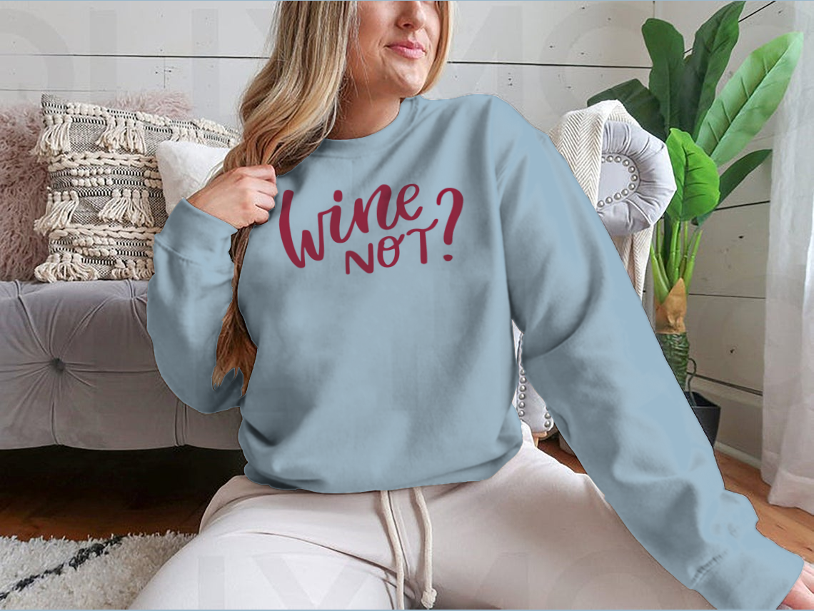 A stylish shirt featuring a positive quote in elegant calligraphy, perfect for wine lovers.