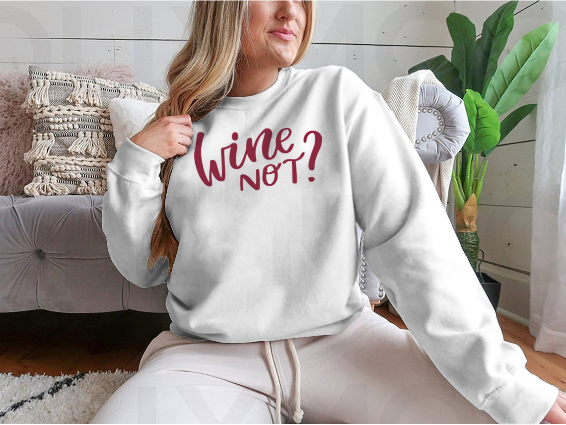 A stylish shirt featuring a positive quote in elegant calligraphy, perfect for wine lovers.