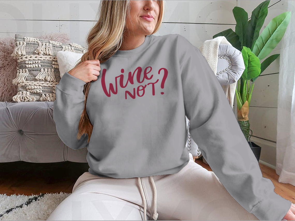 A stylish shirt featuring a positive quote in elegant calligraphy, perfect for wine lovers.