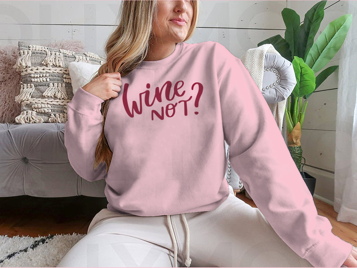 A stylish shirt featuring a positive quote in elegant calligraphy, perfect for wine lovers.