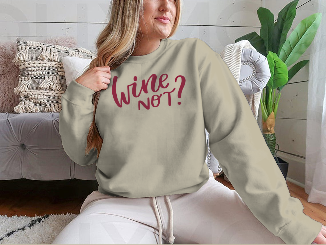 A stylish shirt featuring a positive quote in elegant calligraphy, perfect for wine lovers.