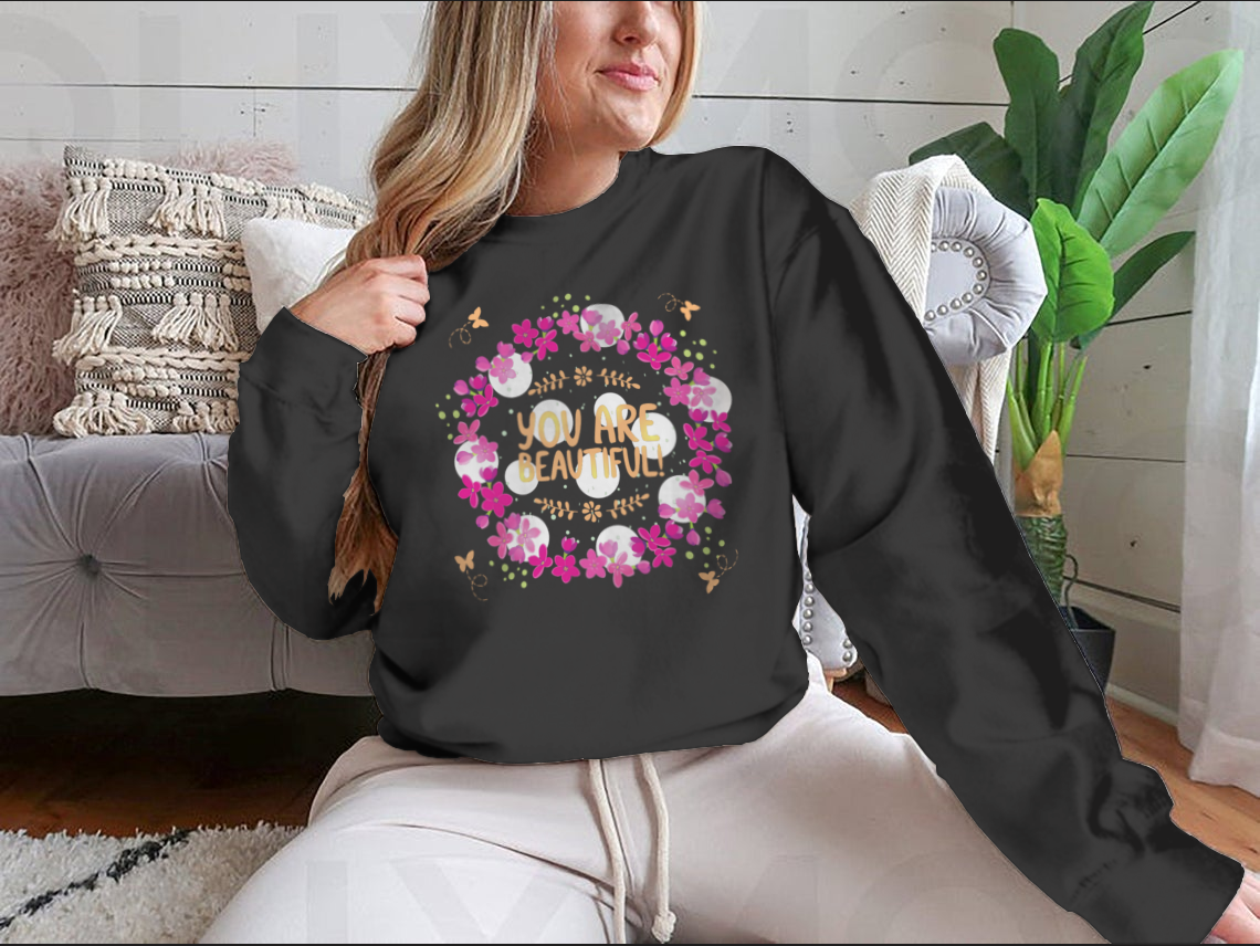 A cozy sweatshirt featuring the inspirational phrase 'You Are Beautiful' in a stylish design, perfect for casual wear.