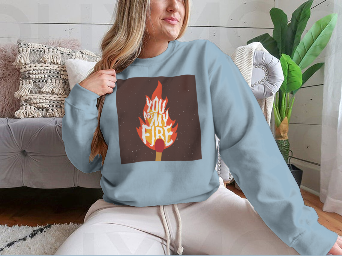 A stylish t-shirt featuring the motivational quote 'You Are My Fire' designed for comfort and inspiration.