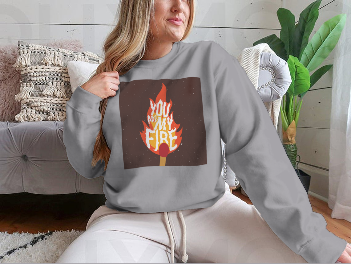 A stylish t-shirt featuring the motivational quote 'You Are My Fire' designed for comfort and inspiration.