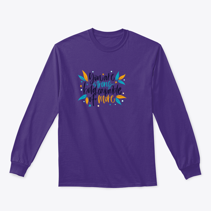 A motivational apparel piece featuring the phrase 'You Are Strong, Bold, Capable Of More' in a stylish design, made from a comfortable cotton-polyester blend.