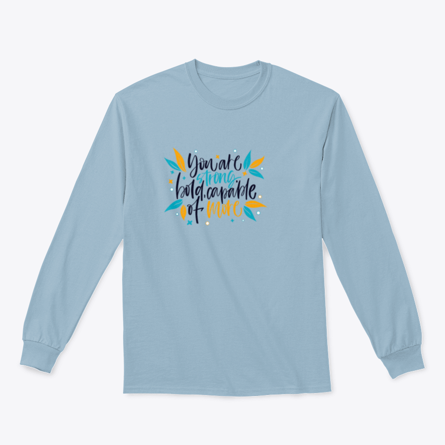 A motivational apparel piece featuring the phrase 'You Are Strong, Bold, Capable Of More' in a stylish design, made from a comfortable cotton-polyester blend.