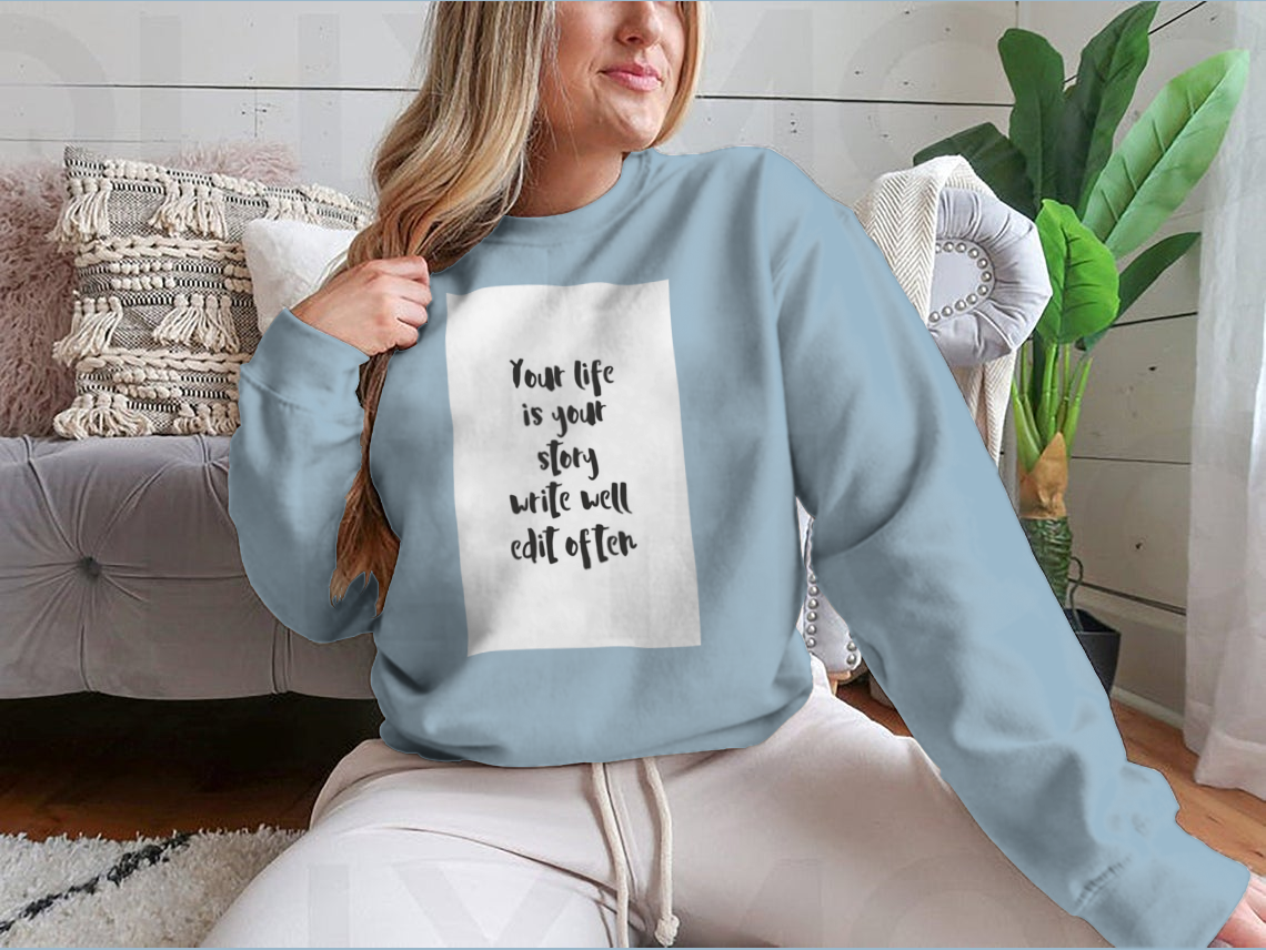 A motivational quote apparel featuring the phrase 'Your Life Is Your Story Write Well Edit Often' on a comfortable cotton/polyester blend fabric.