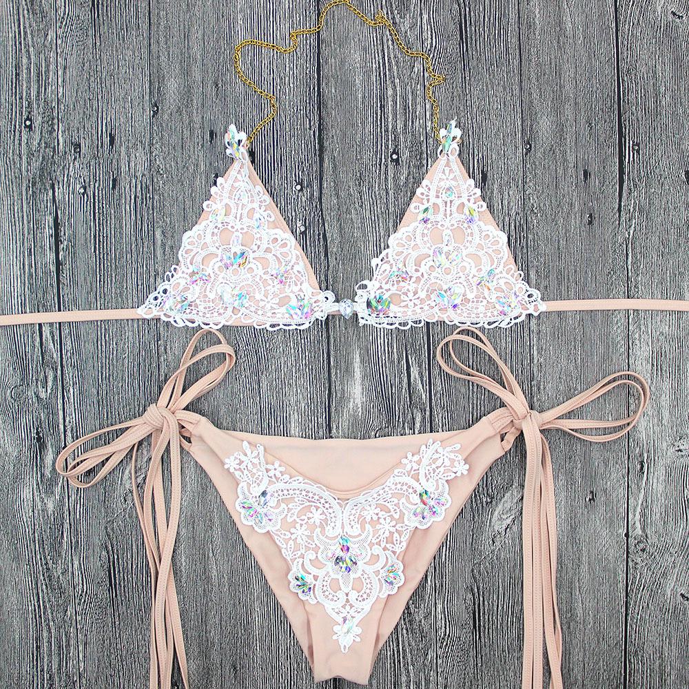 White lace bikini on wood.